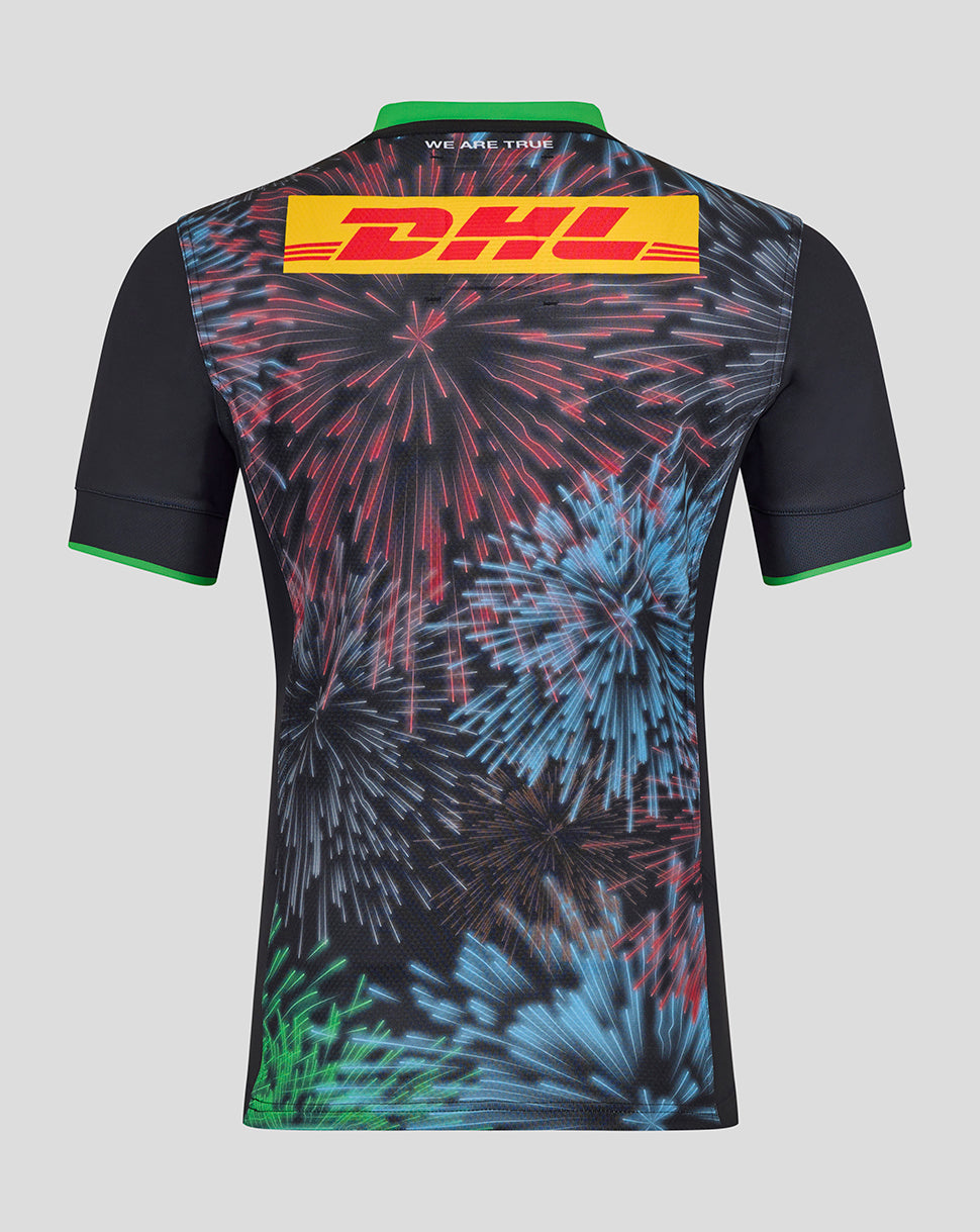 Back view of Harlequins Big Game Pro Shirt with multicolored fireworks print, DHL patch across the upper back, green collar and sleeve trim