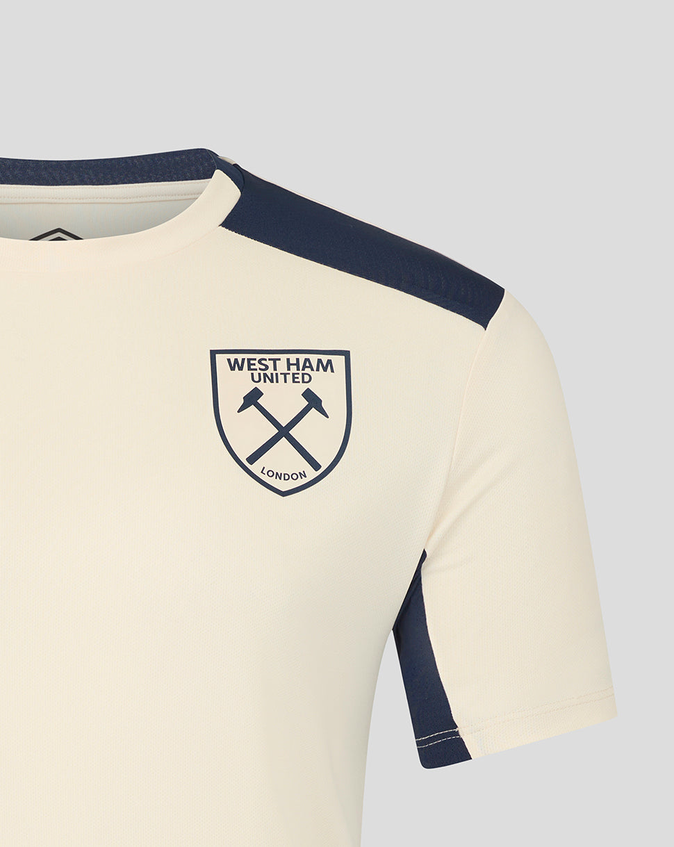 Close up of burgundy West Ham pro training short sleeve shirt showing crest and Umbro logo