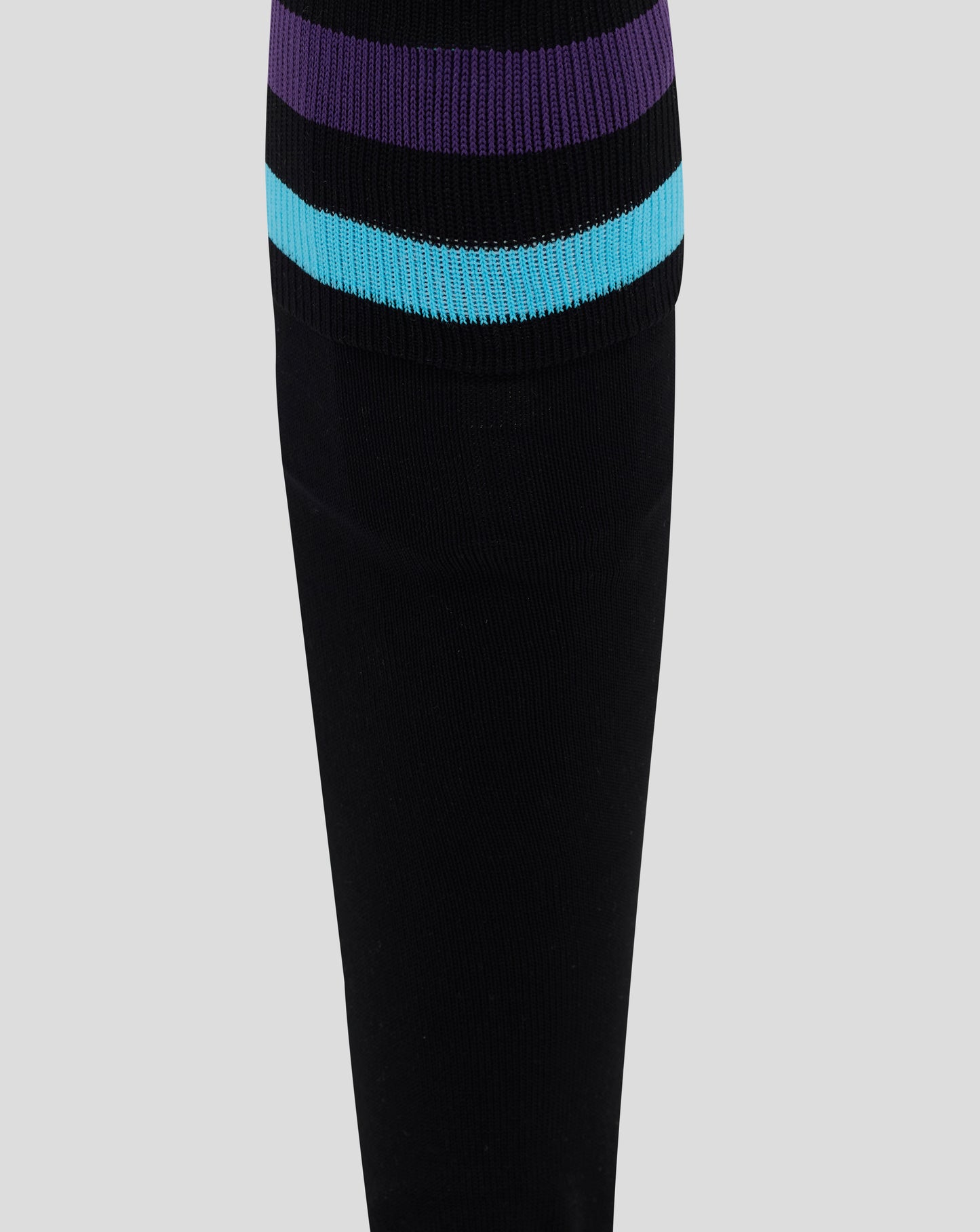 Angled view of the sock cuff with purple and turquoise stripes on the England Rugby junior alternate sock