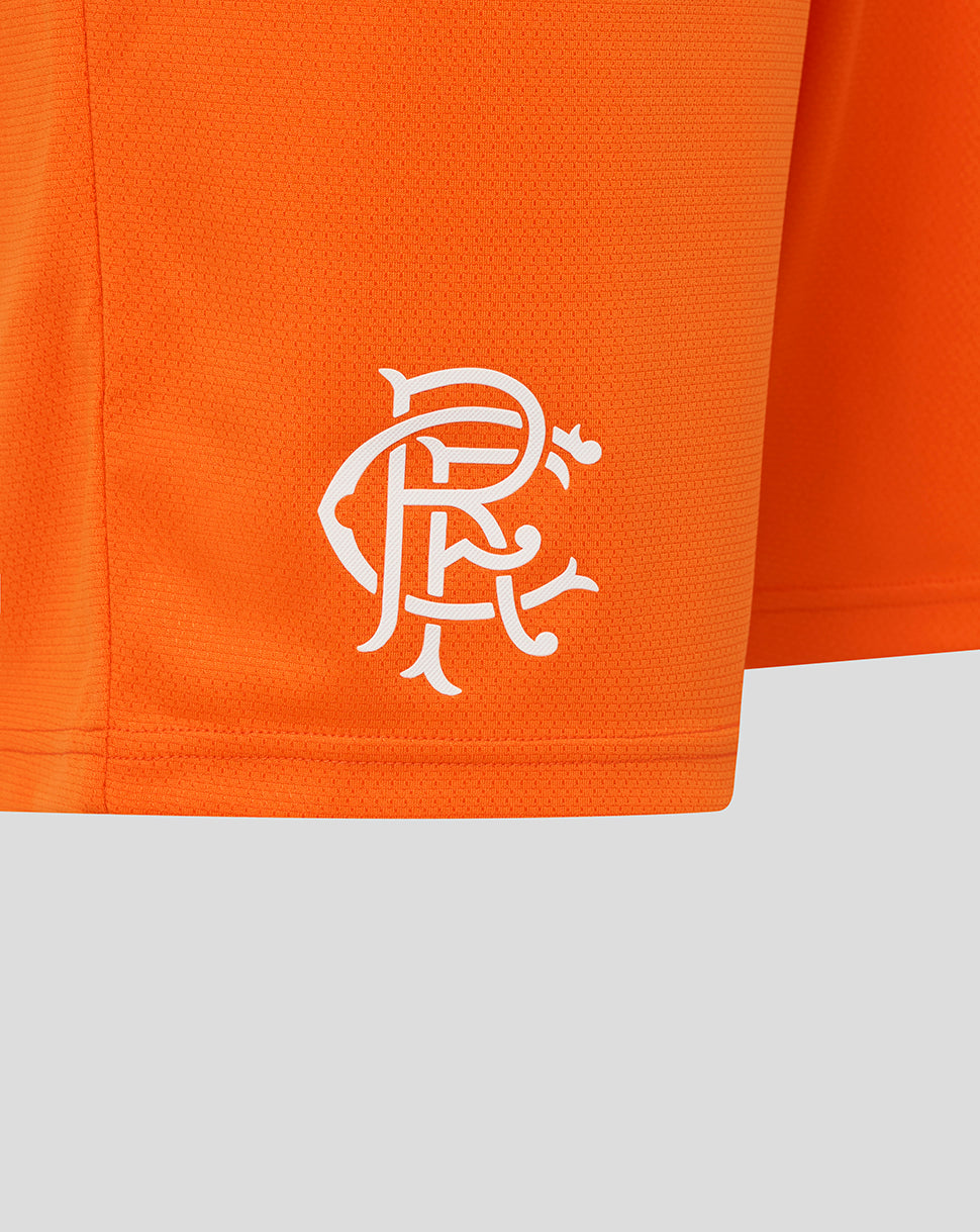 White Rangers crest on bright orange shorts fabric near the hem