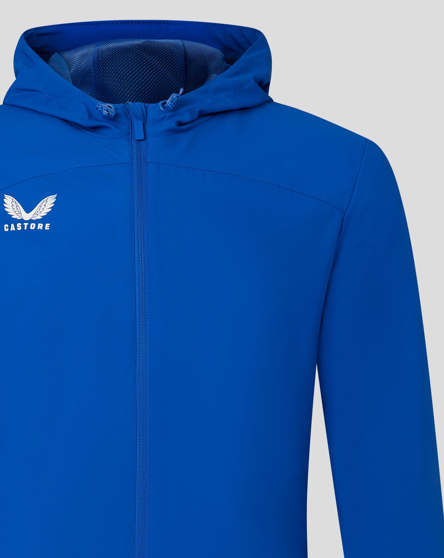 Blue rain jacket with hood up and front zip, Castore logo on left chest.