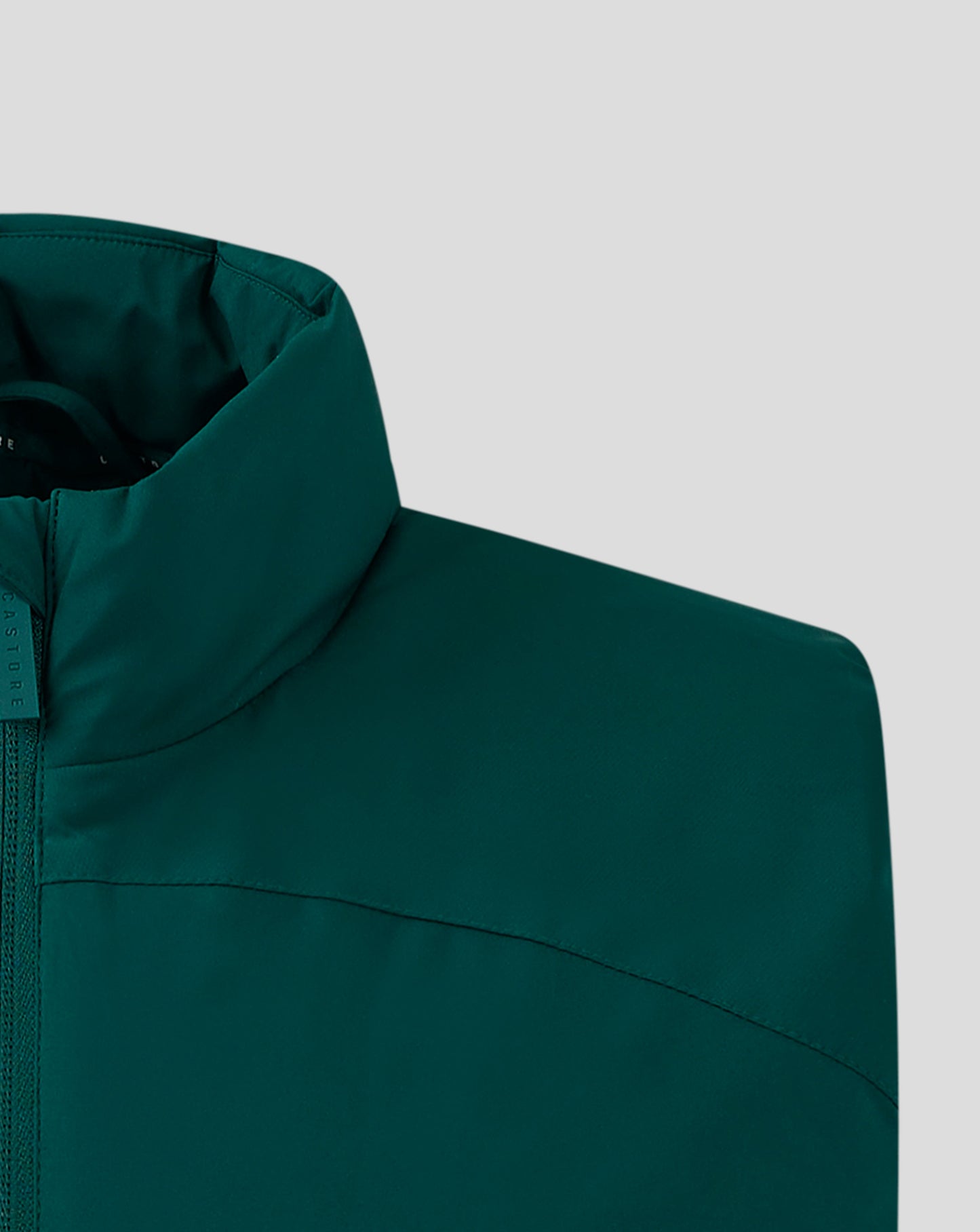 Teal padded gilet close up with funnel neck and front zip