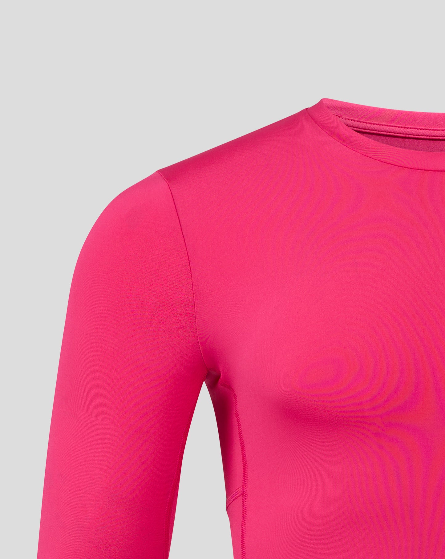 Beetroot purple mens baselayer long sleeve top with underarm and side panels and heat sealed Castore logo.