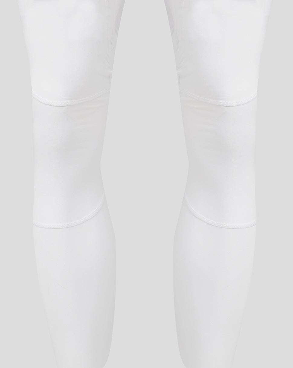White leggings showing knee panel seams and curved stitching details