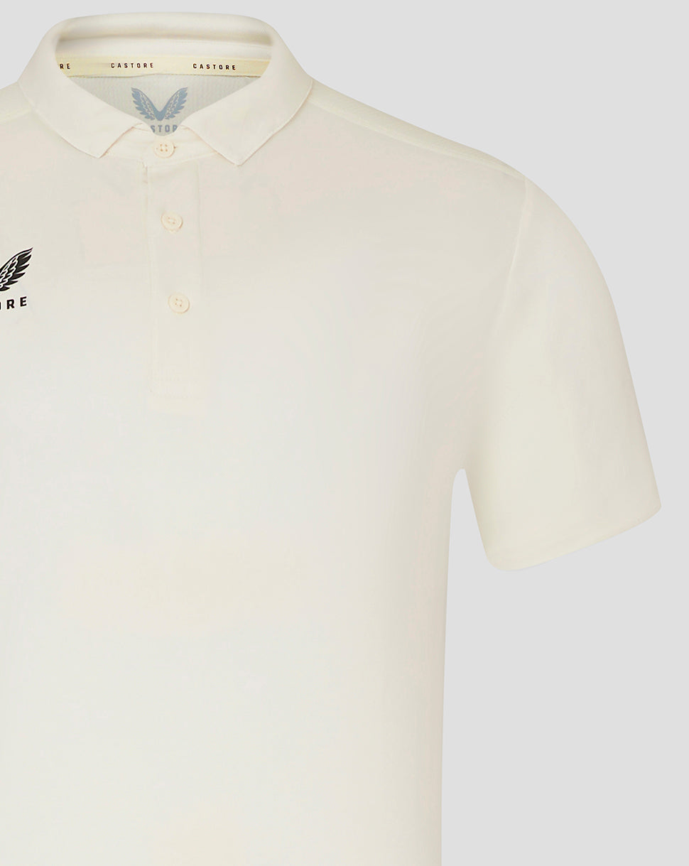 Cream mens cricket polo with self fabric collar three button placket and chest Castore logo