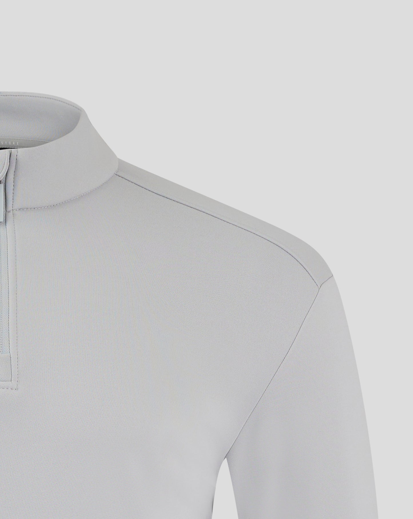 Close up of light gray fleece jacket showing funnel neck and zip detail with chest logo
