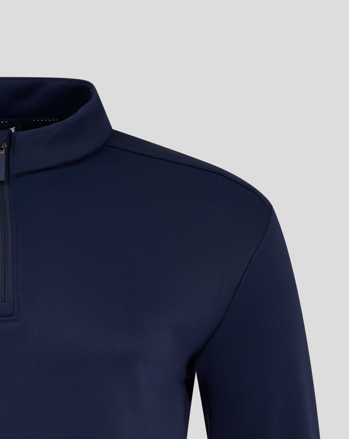 Navy fleece lined 1/4 zip jacket with funnel neck and soft brushed interior plus heat sealed Castore logo