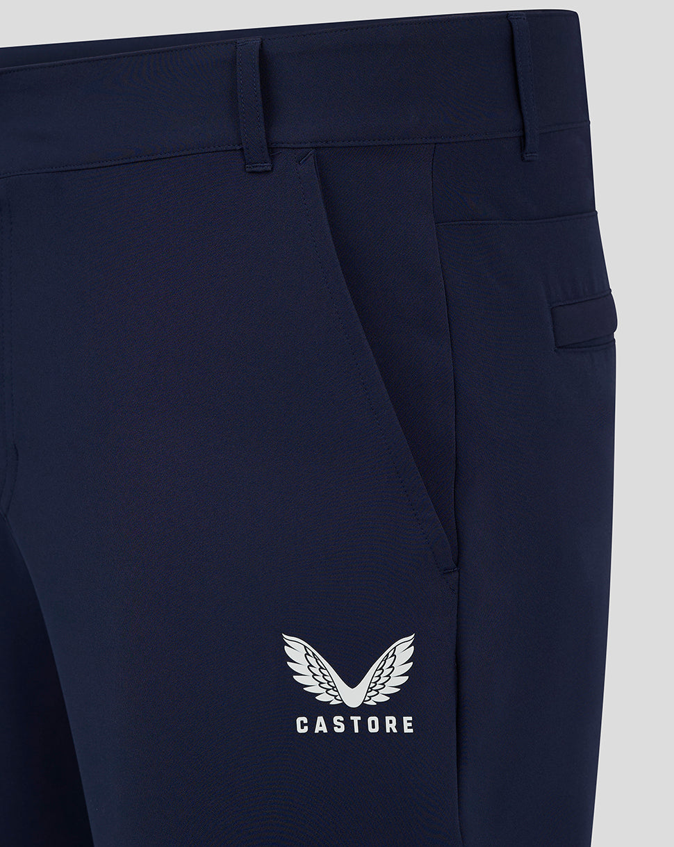 Close up of navy chino pant with Castore winged logo on lower thigh