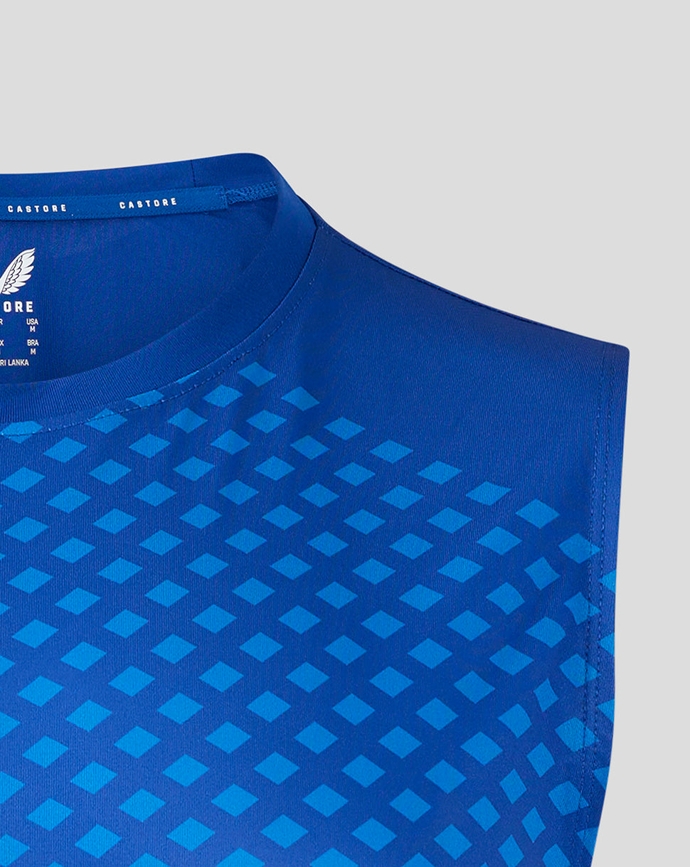 Blue geometric vest close-up at neckline and shoulder seam showing the square pattern.