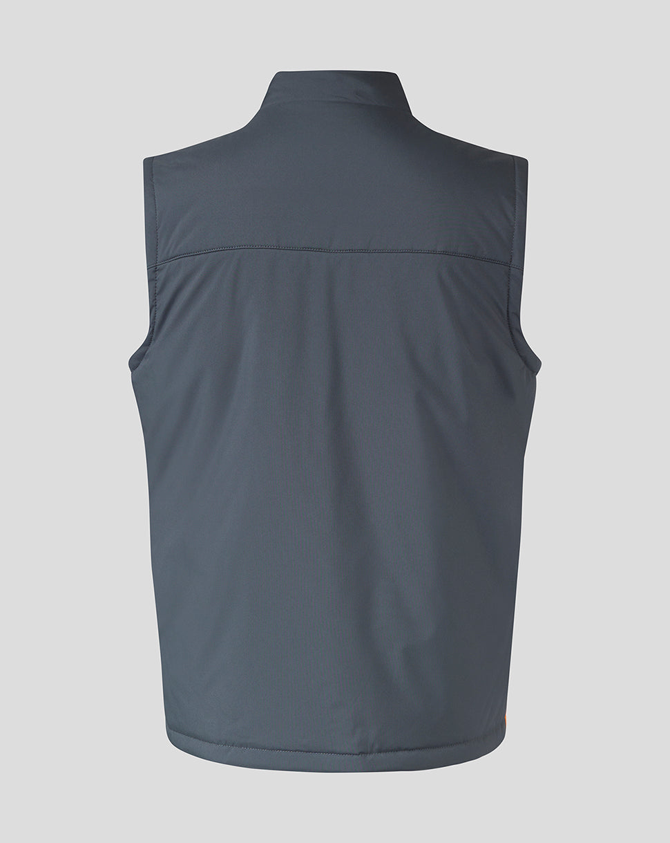 Back view of a navy sleeveless training gilet with chevron panels