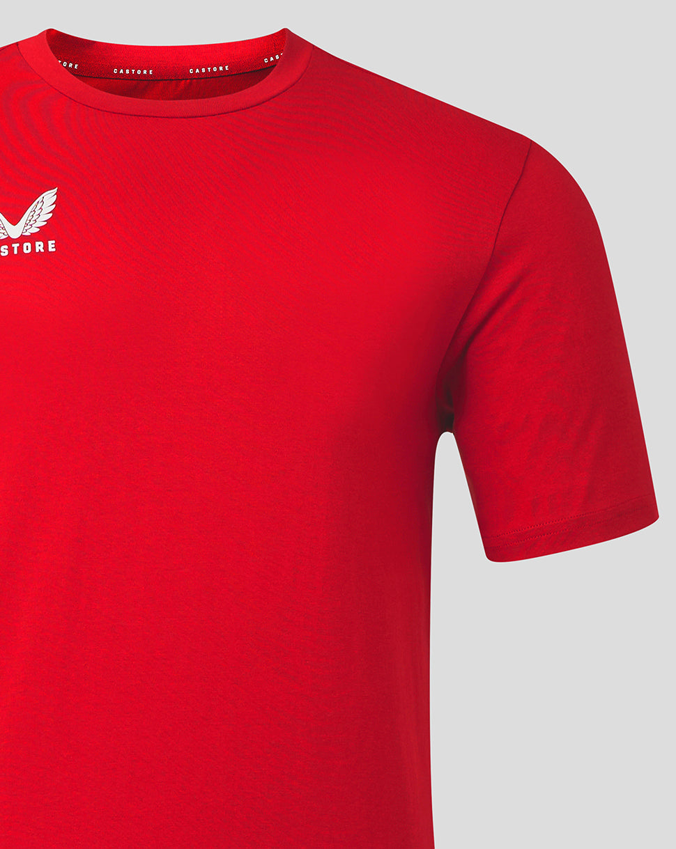 Close crop of front left chest with white Castore logo on red tee