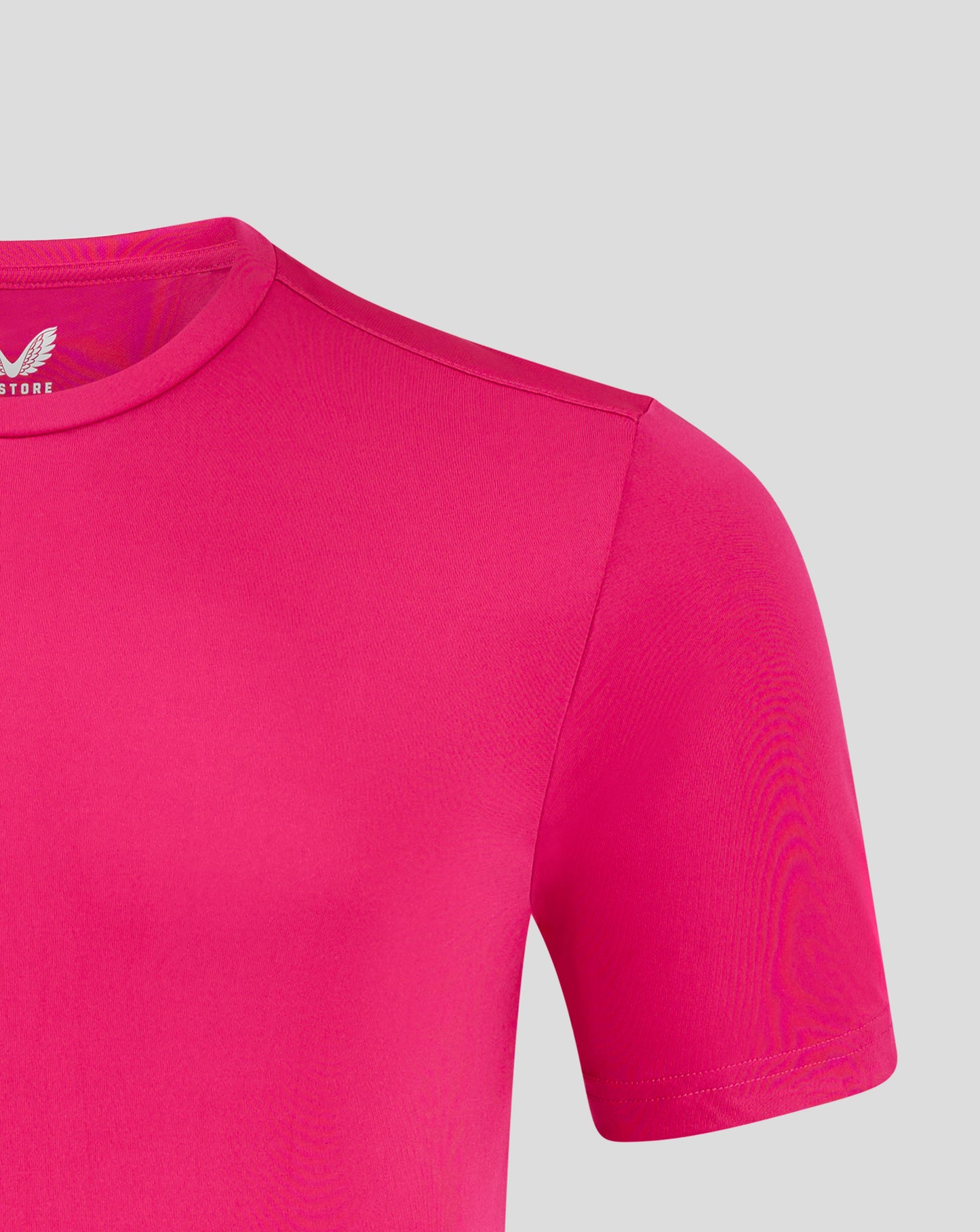 Front chest view of beetroot purple tee featuring white Castore logo with wings