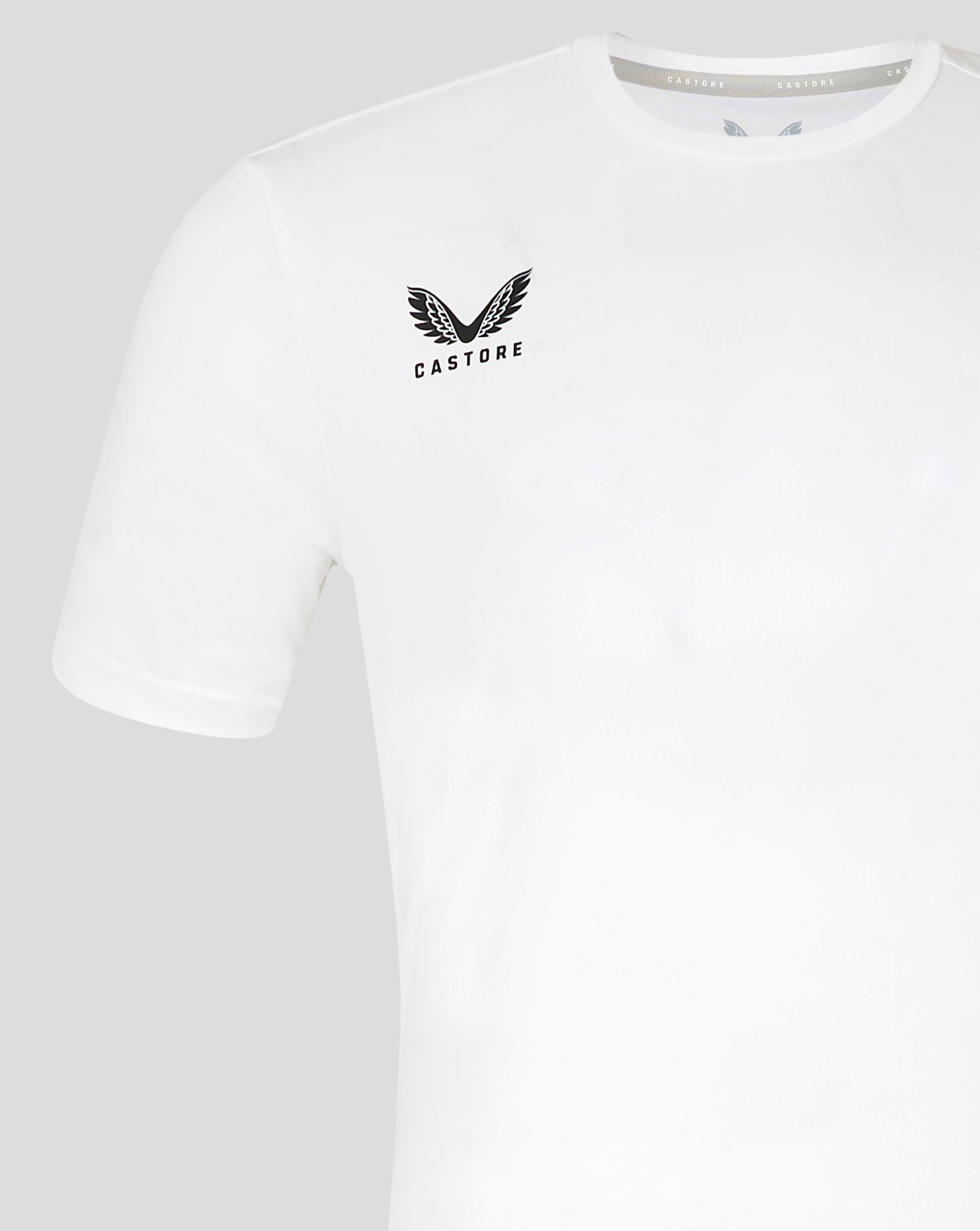 Front view of white performance tee showing left chest Castore logo and shoulder detail