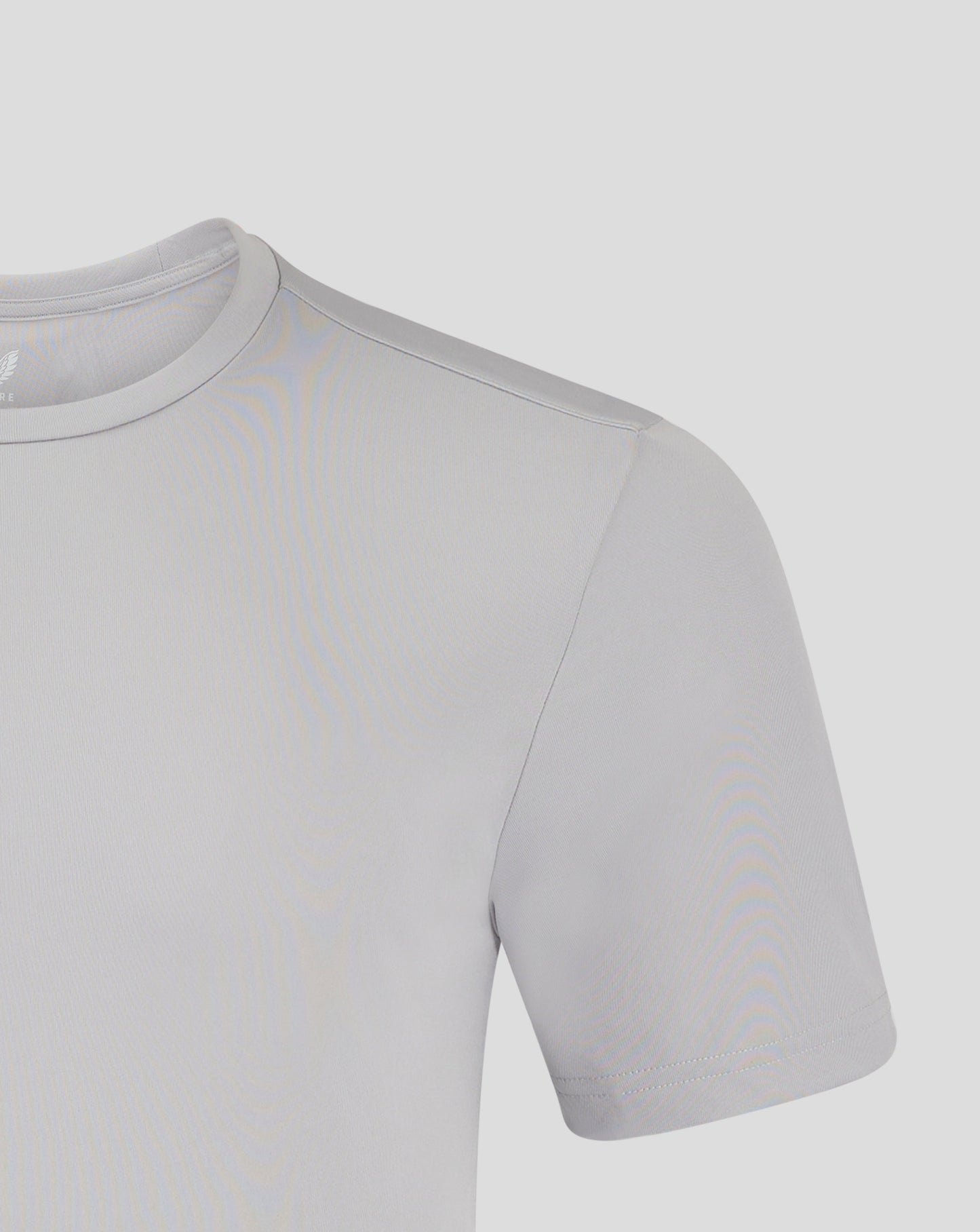 Close-up of light gray crew neck performance tee showing a shoulder seam and Castore logo.