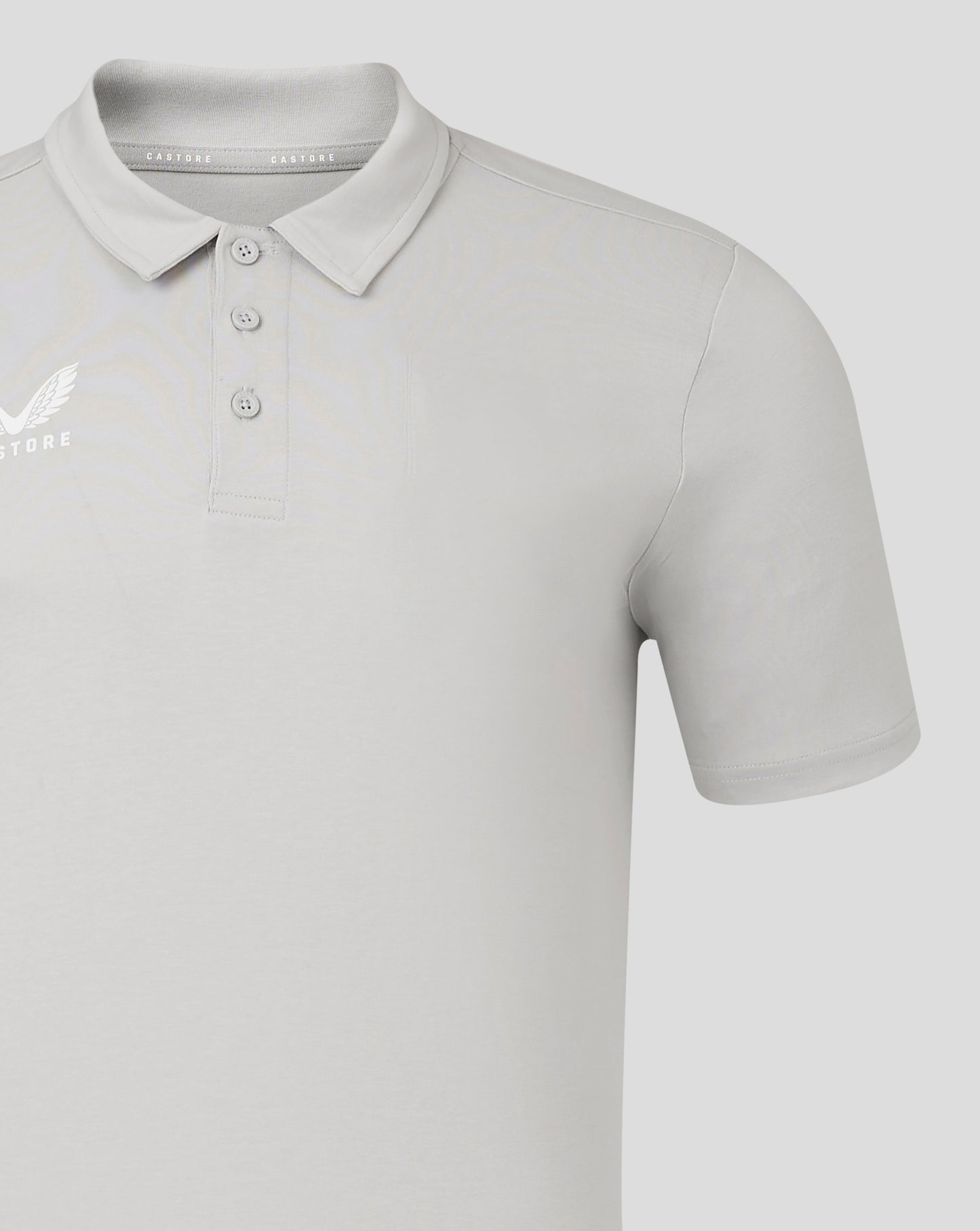 Close-up of polo collar and shoulder with Castore branding on the inner collar