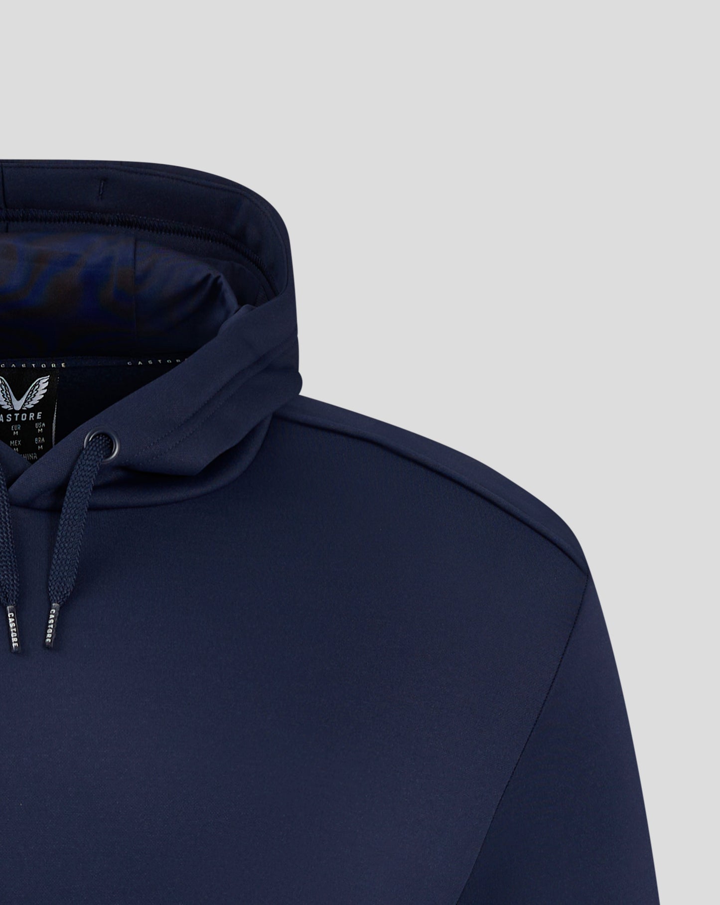 Peacoat colored men's performance overhead hoodie close-up of the hood, drawstrings, and zipper.
