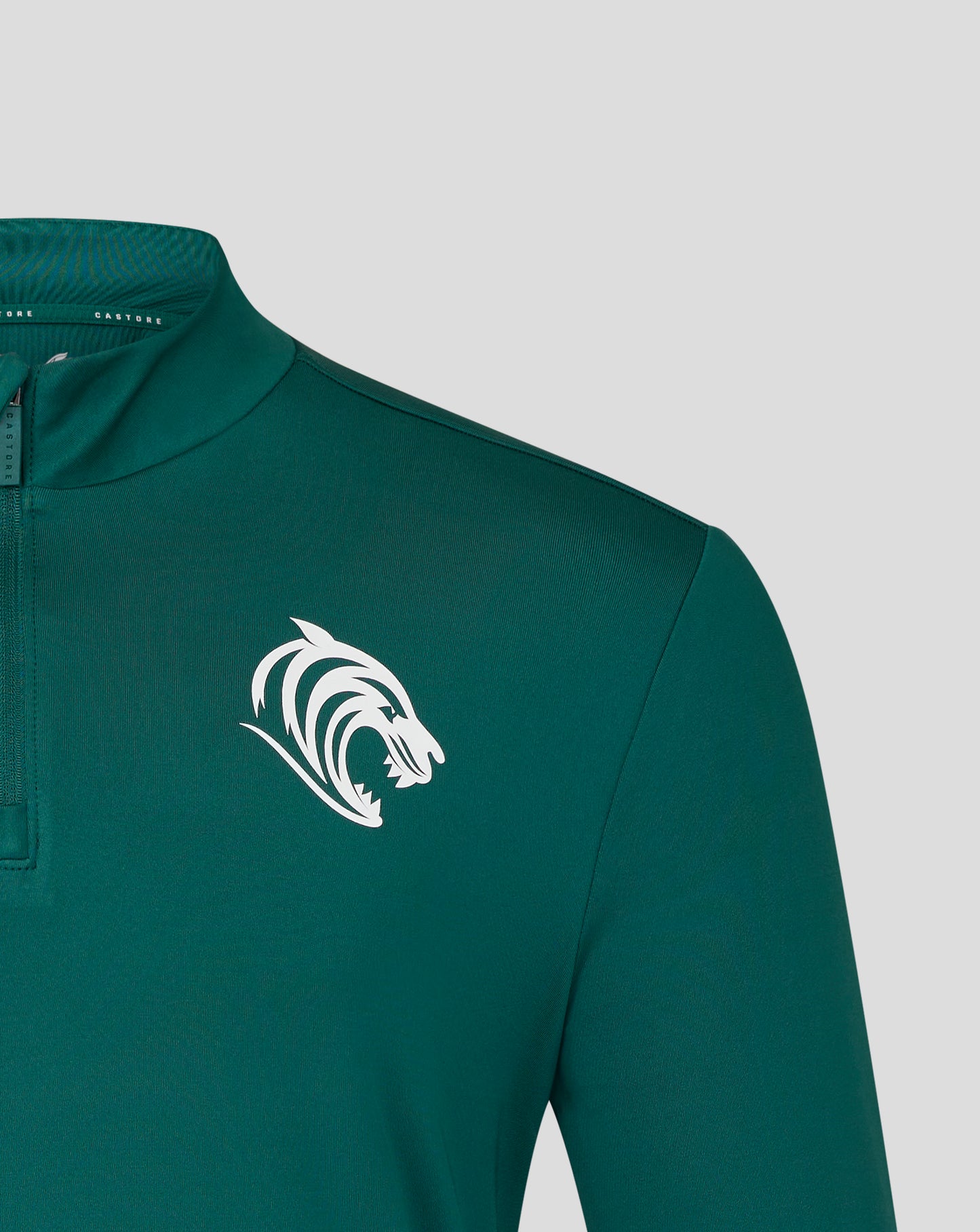 Dark green training midlayer with white Castore wing logo on the left chest and a tiger crest on the right chest.