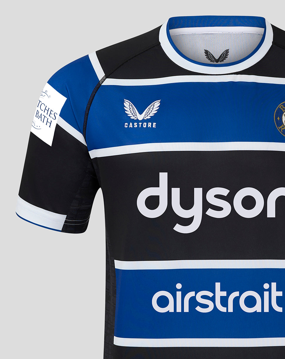 Back view of Bath Rugby Home Shirt showing GRANT sponsor on a white panel and VINALBA Argentina branding at the blue hem