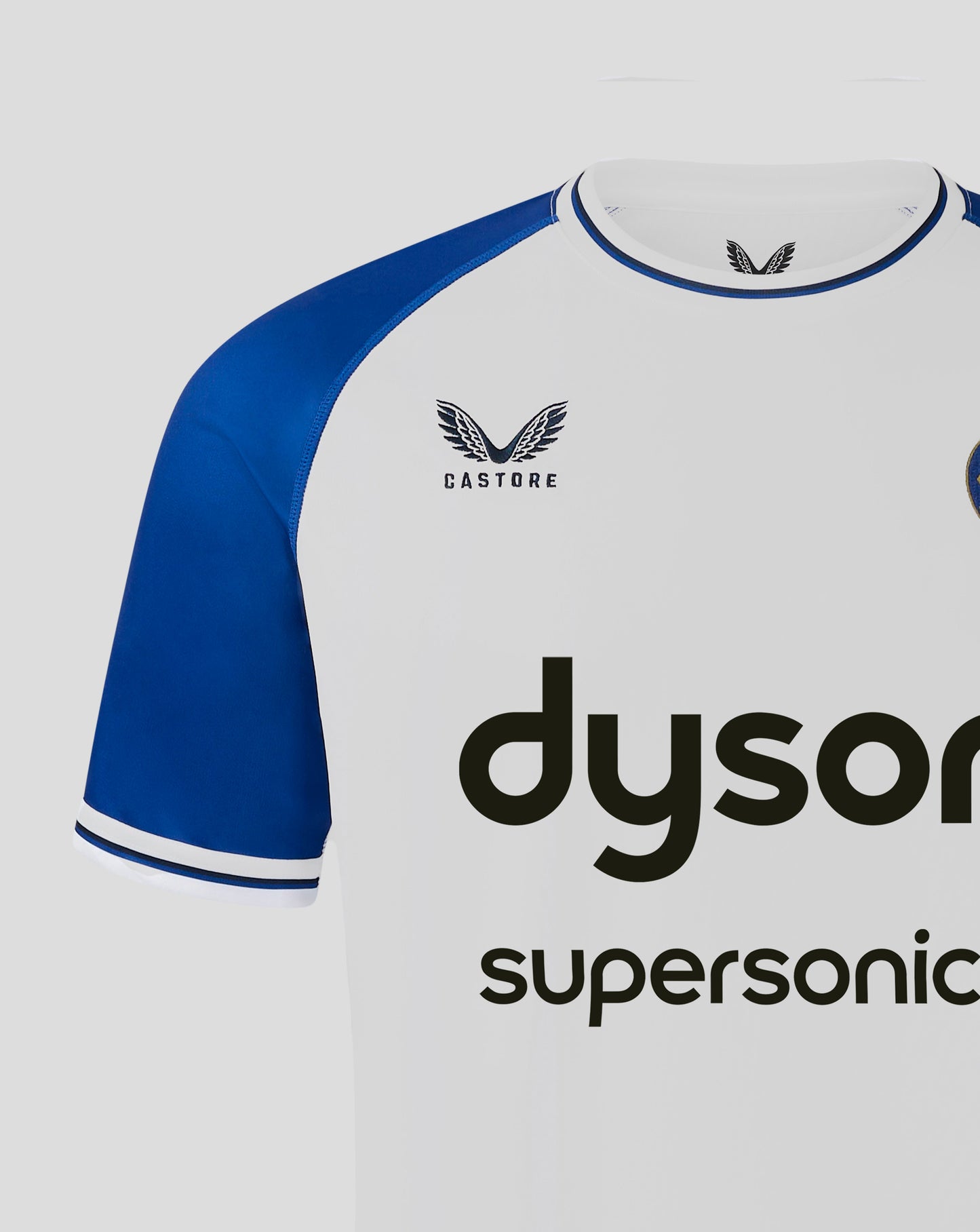 Bath Rugby away shirt front view with white body blue sleeves Dyson sponsor across chest Bath crest left chest Castore branding right chest