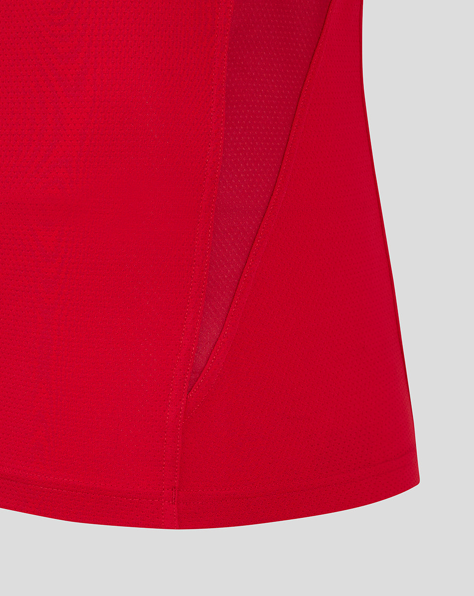 Close-up of red Scarlets training T shirt showing curved hem and side panel seam