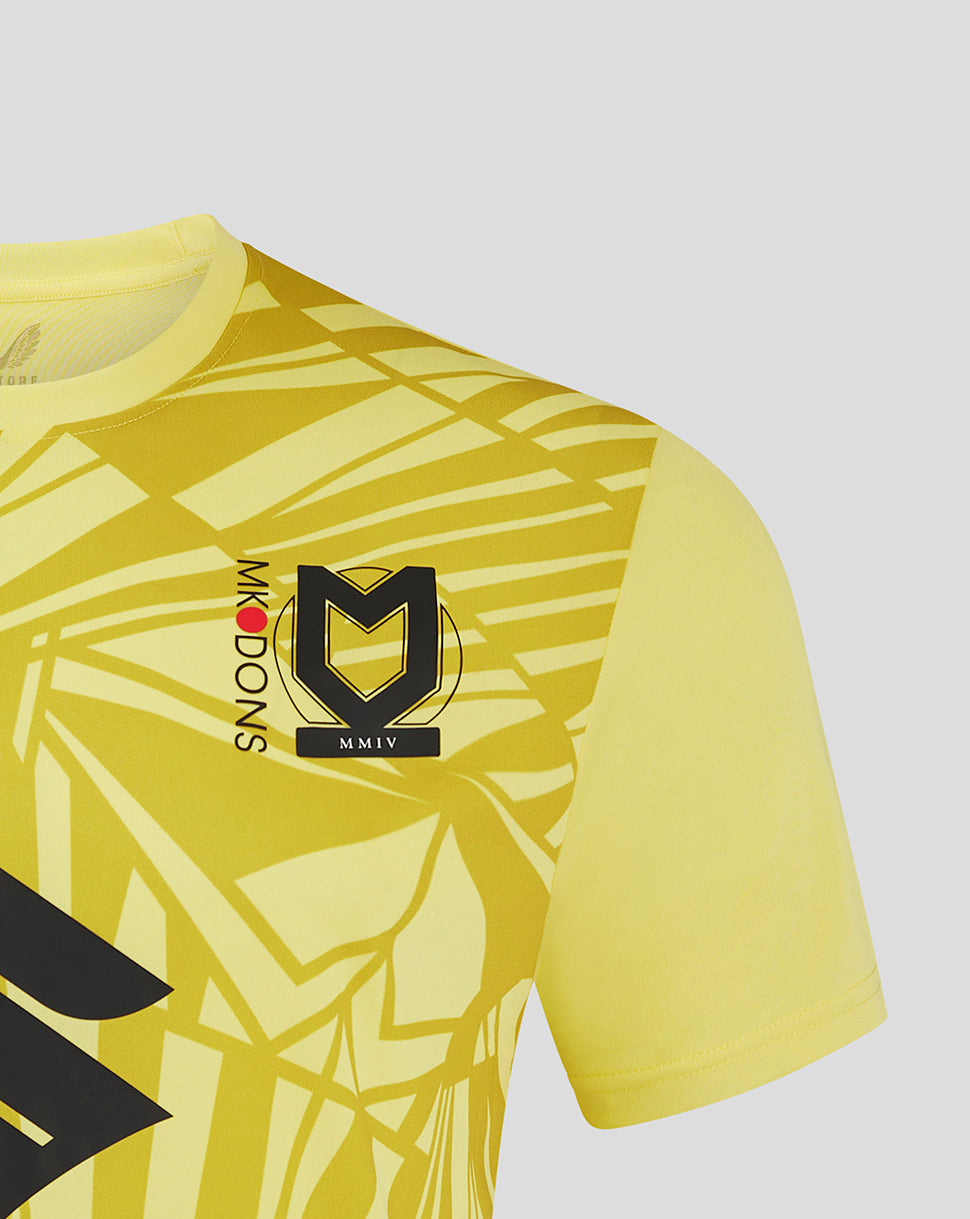 Shoulder and chest close-up of Mk Dons away goalkeeper shirt with bold geometric print crest and Mk Dons lettering