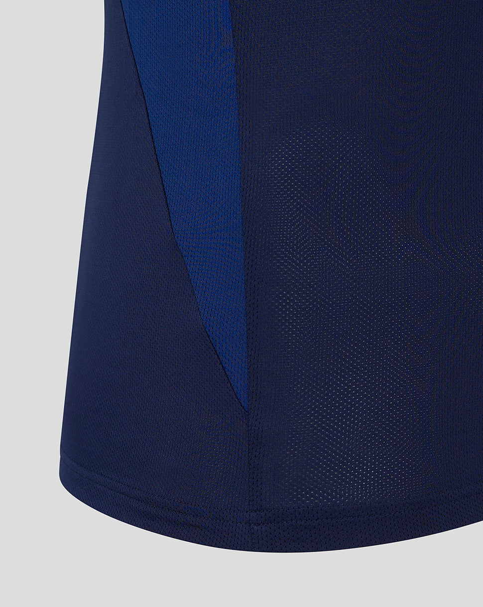 Close up of navy training tee side panel with blue color block and breathable mesh fabric texture