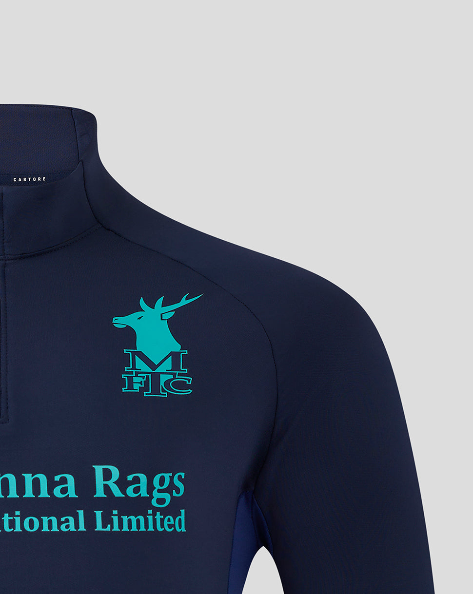Navy Mansfield training top close up showing turquoise crest on left chest and Castore branding at the collar