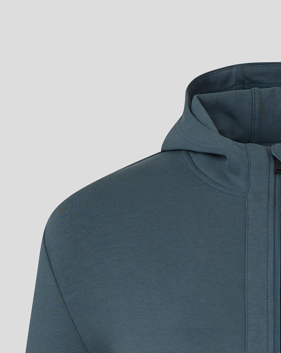 Close up of shoulder and hood on the blue Preston NE travel jacket highlighting fabric texture and stitching