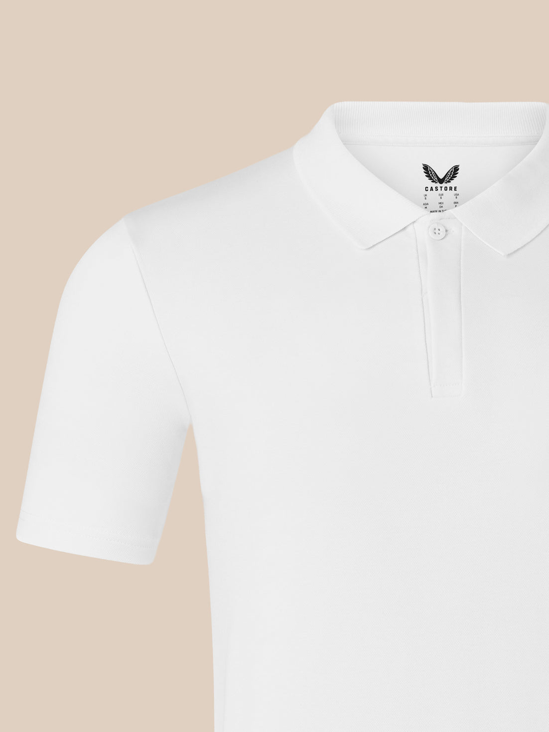 White men's short sleeve polo with ribbed collar and button placket and subtle chest logo