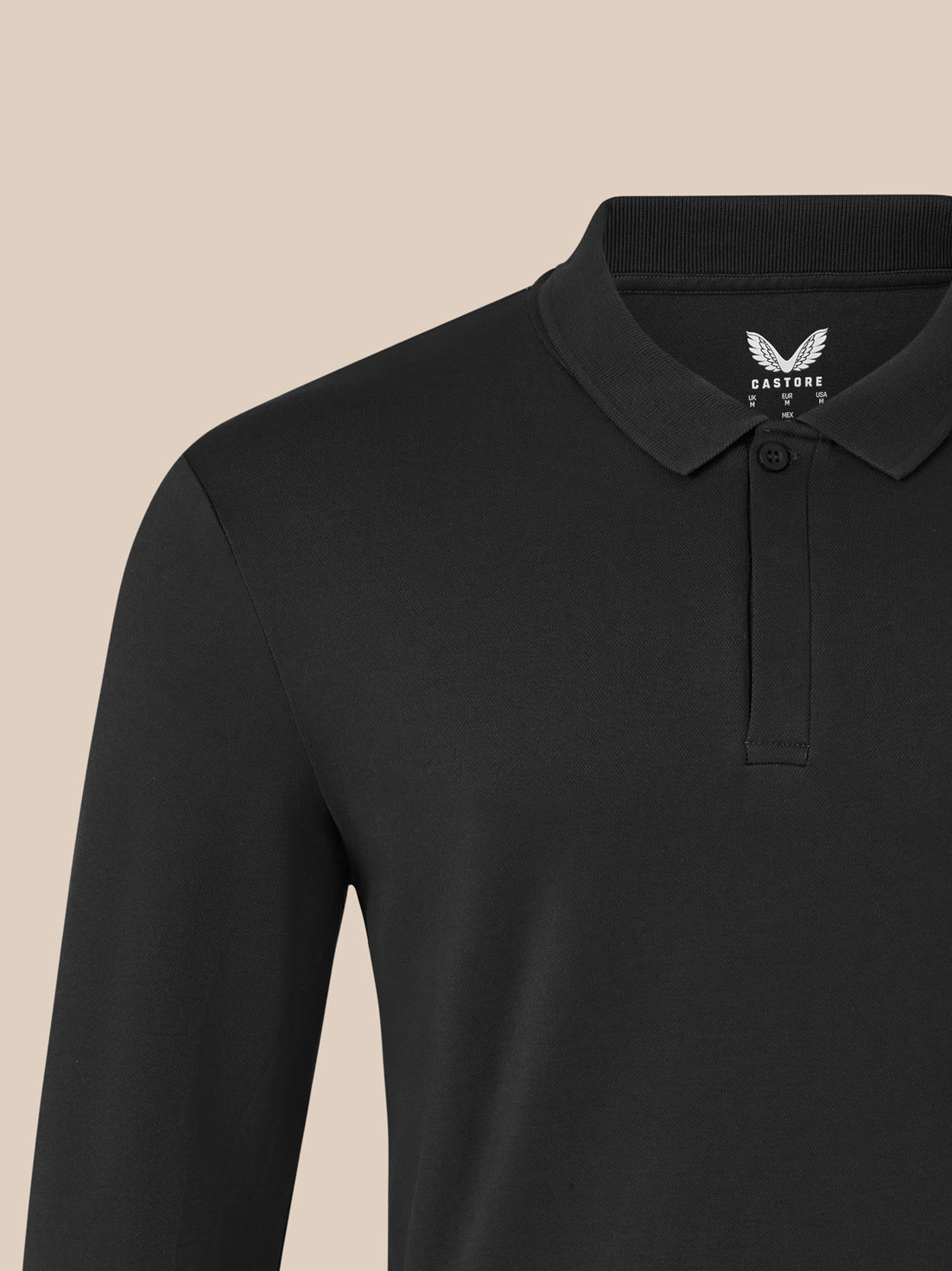 Close-up of black long sleeve polo collar with ribbed detail and chest embroidery