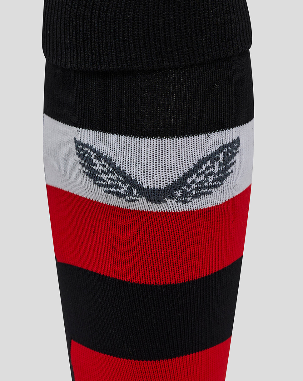 Ulster home socks close up showing black cuff white and red stripes with a wing crest.