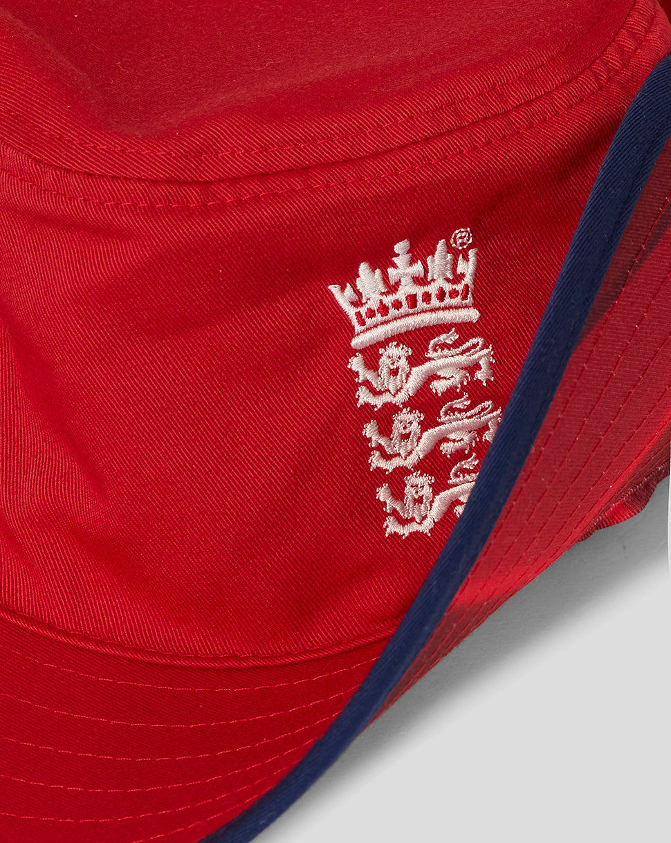 Close-up of the white England team crest embroidered on red hat fabric
