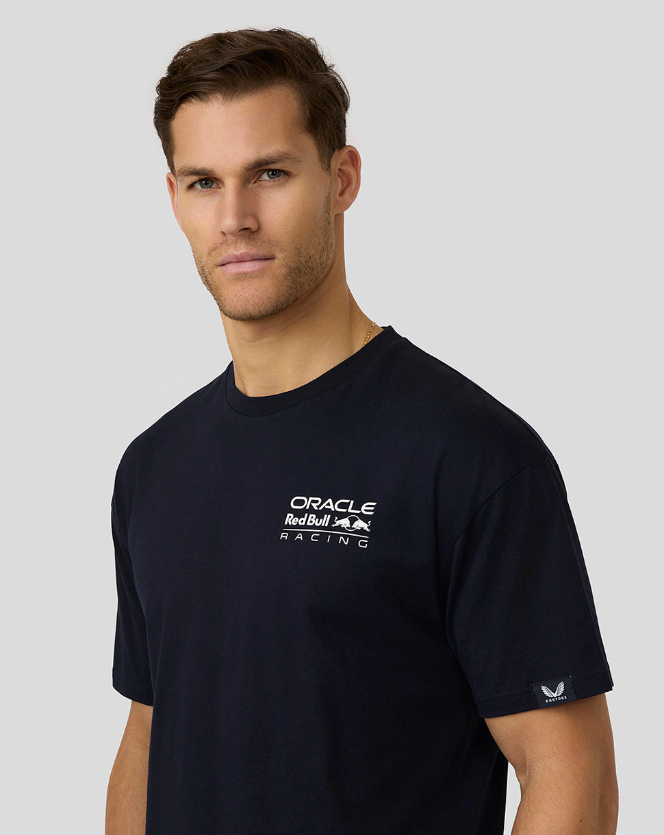 Front quarter view of a man in a navy Oracle Red Bull Racing T shirt with a small chest logo and sleeve badge.