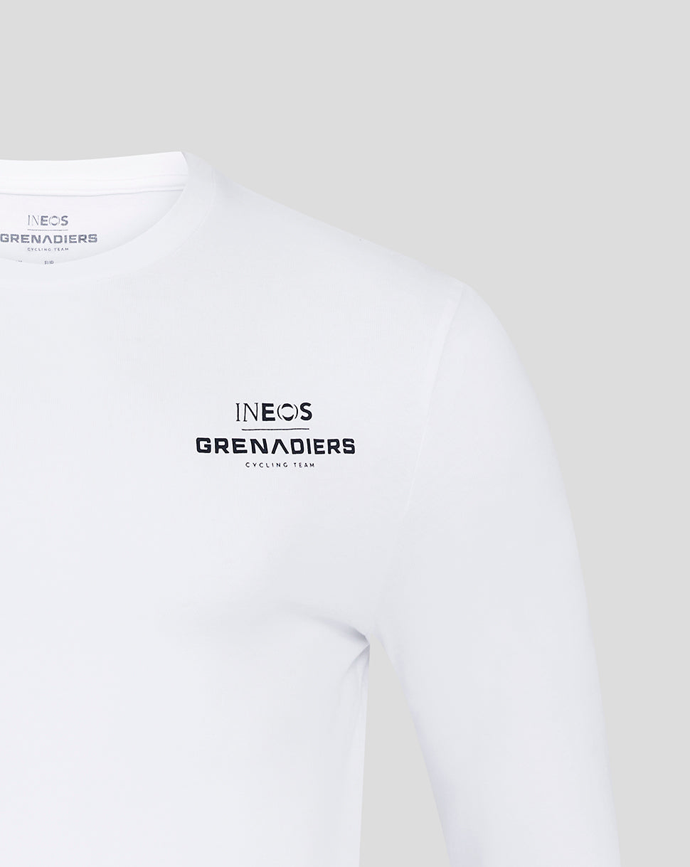 Upper chest and shoulder view of white INEOS Grenadiers long sleeve tee with chest branding