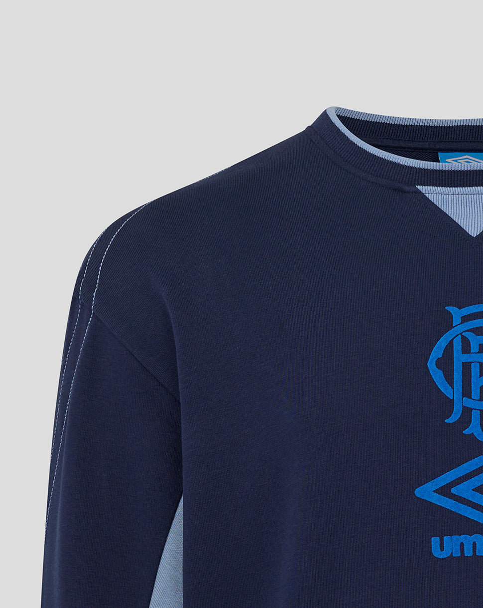 Shoulder close-up of navy Rangers travel crew sweat showing seam stitching and light blue neckline trim
