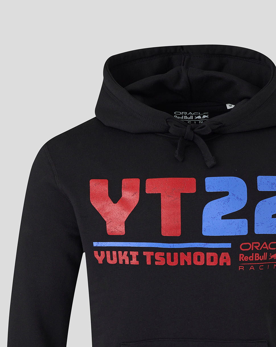 Close-up of black hoodie showing large red and blue YT22 graphic with Yuki Tsunoda name and Oracle branding