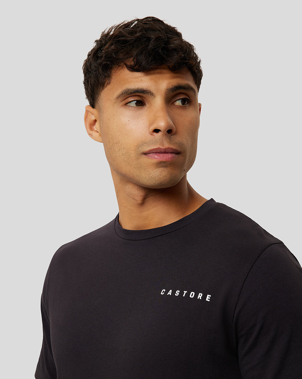 Close-up of black T-shirt showing the white CASTORE logo on the chest