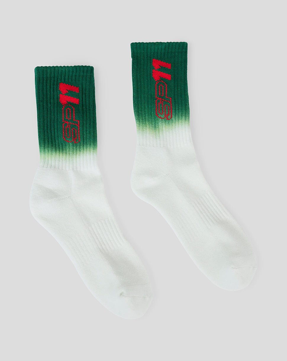 Green to white gradient ribbed crew socks with red branding on the cuff.