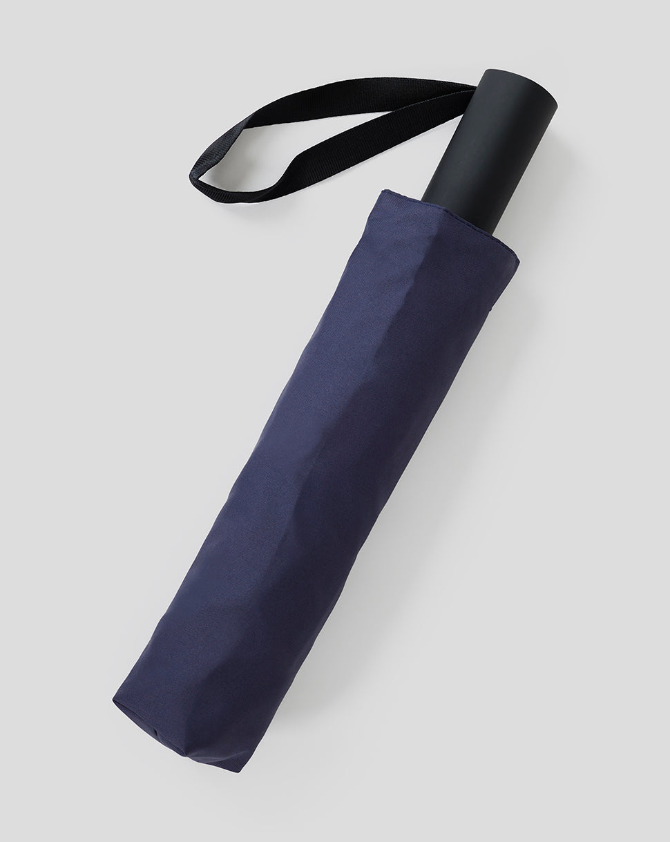Oracle Red Bull Racing night sky short umbrella rolled with a black loop strap and matching sleeve