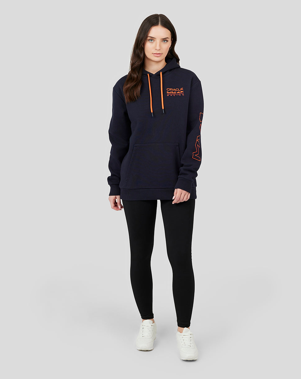 Female model wearing navy Night Sky Oracle Red Bull Racing hoodie with orange drawstrings and chest logo and sleeve logos