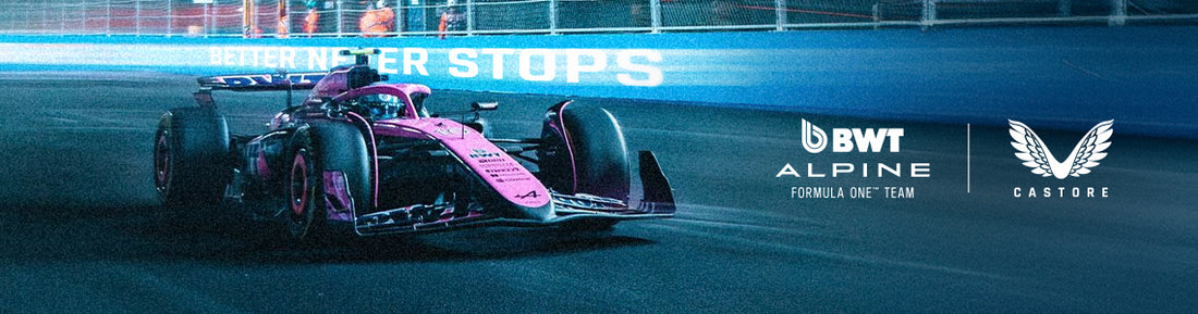 Nighttime Formula One car on a race track with BWT Alpine and Castore branding