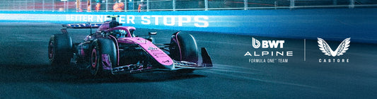 Nighttime Formula One car on a race track with BWT Alpine and Castore branding