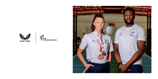 Two GB Taekwondo athletes in Castore shirts pose with medals in a training hall, with Castore and GB Taekwondo logos visible.