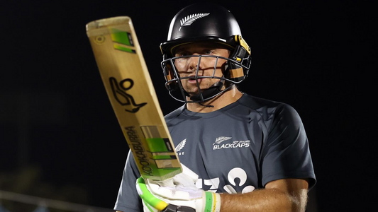 New Zealand Black Caps batsman wearing a helmet with the fern logo and gripping a bat in action