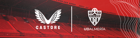 Castore and UD ALMERIA partnership banner with winged logo on the left and club crest on the right against a red and navy backdrop.