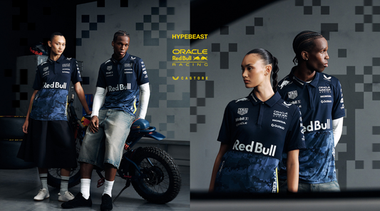 Group of four models wearing navy Oracle Red Bull Racing Castore apparel against a geometric backdrop.