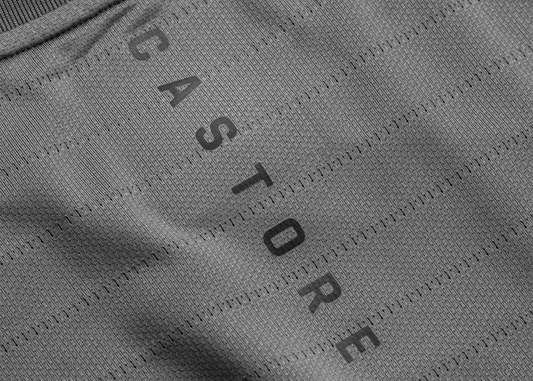 Close up of textured technical workout fabric with diagonal printed letters