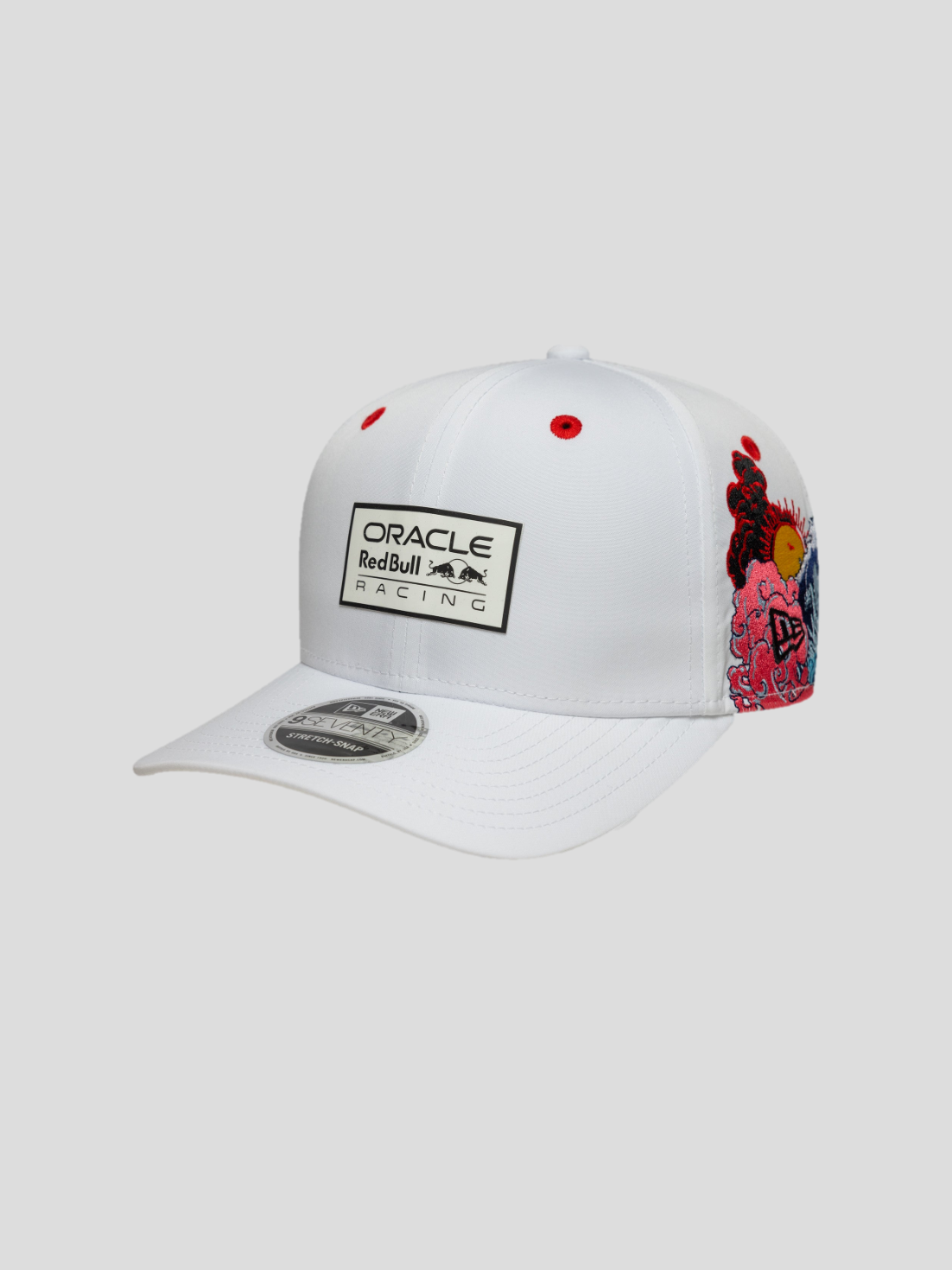 White cap featuring Oracle Red Bull Racing patch on the front and colorful side embroidery with waves and a curved brim