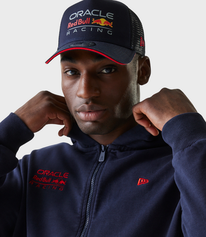 Close up of navy hoodie showing Oracle Red Bull Racing logo on the chest and New Era emblem on the sleeve