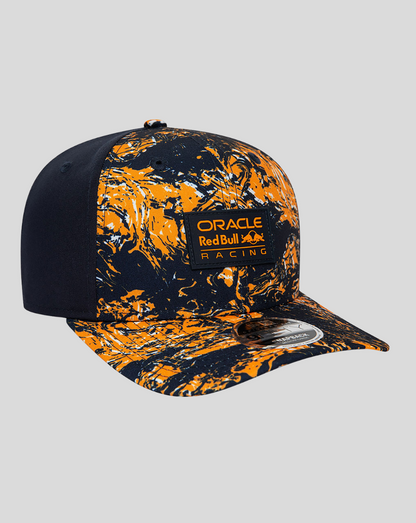 Angled front view of Oracle Red Bull Racing Print 9Fifty cap with orange and navy marbled pattern and logo patch